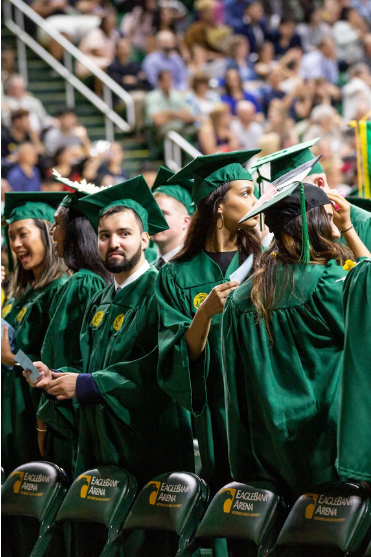 excited graduates awaiting diplomas